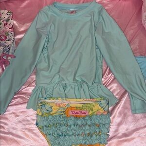 Ruffle Butts Light Blue Swim Top with Pink Tag